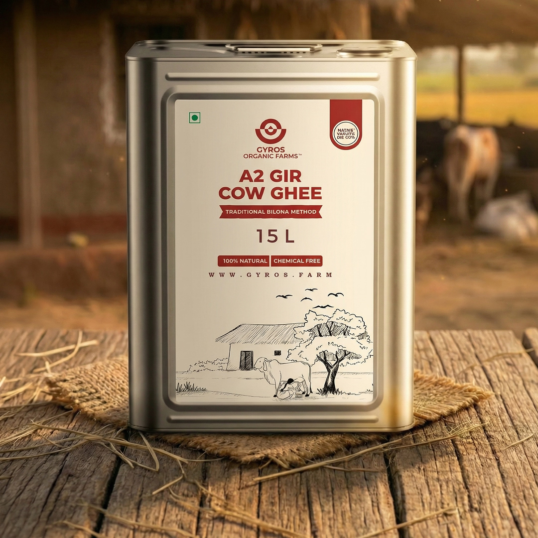 15 litre A2 Gir cow ghee tin pack displayed on a wooden table with rural backdrop